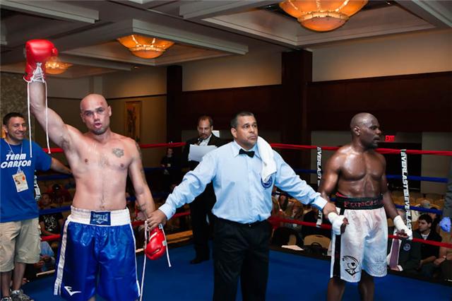 (L) Matthews, hand raised, awaiting the decision. 