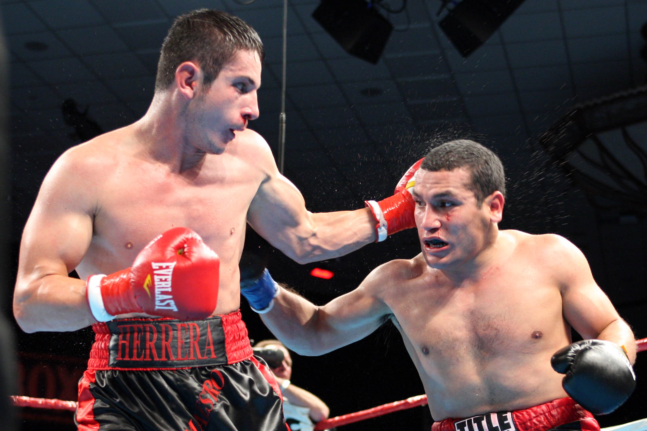 Anchondo, left, of La Puente , Calif. , improved 30-2 with the split decision. Scores were 77-75, 77-75 Anchondo, 79-73 Herrera